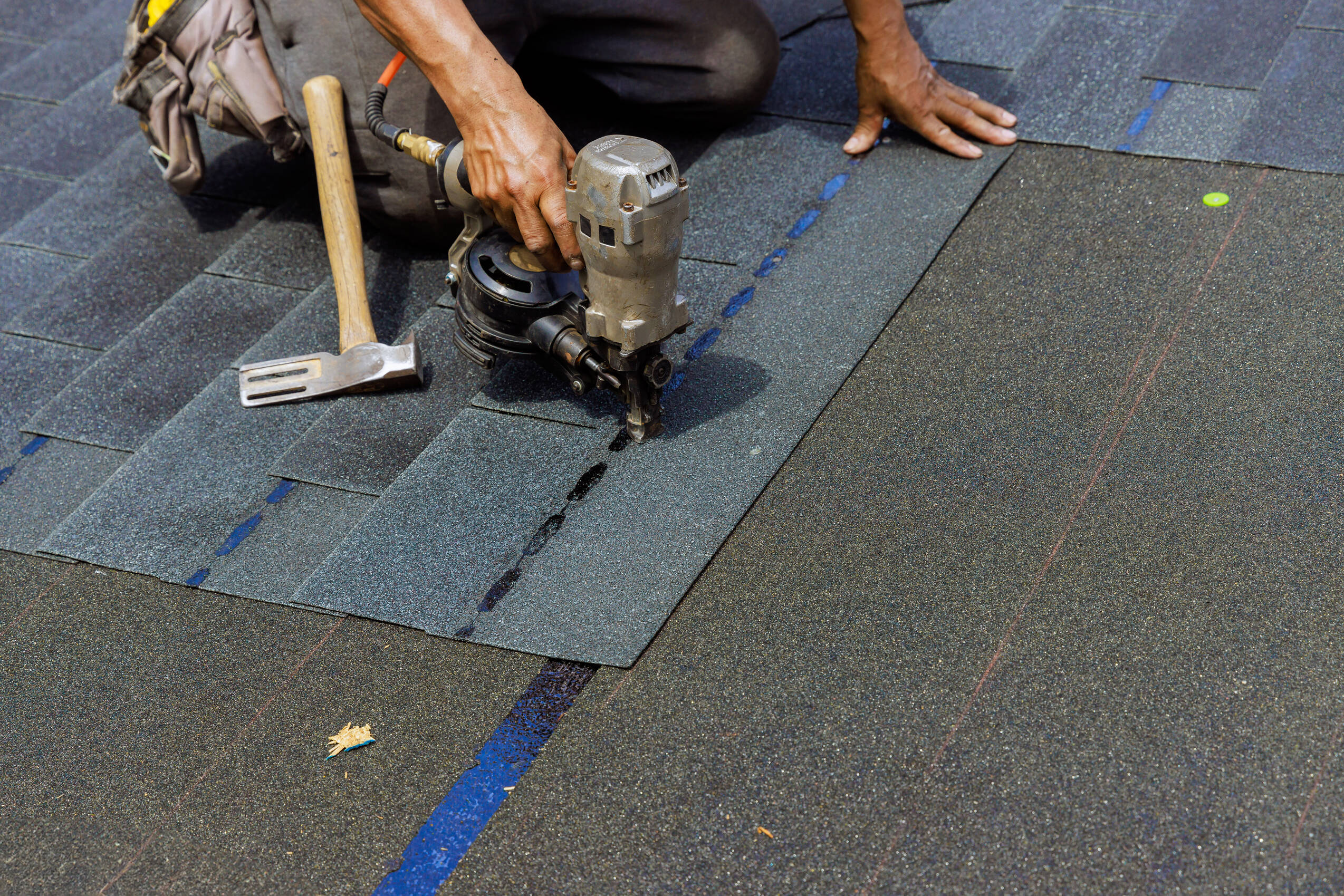 Roofer installing shingles on building constructio 2026 03 25 00 56 03 utc