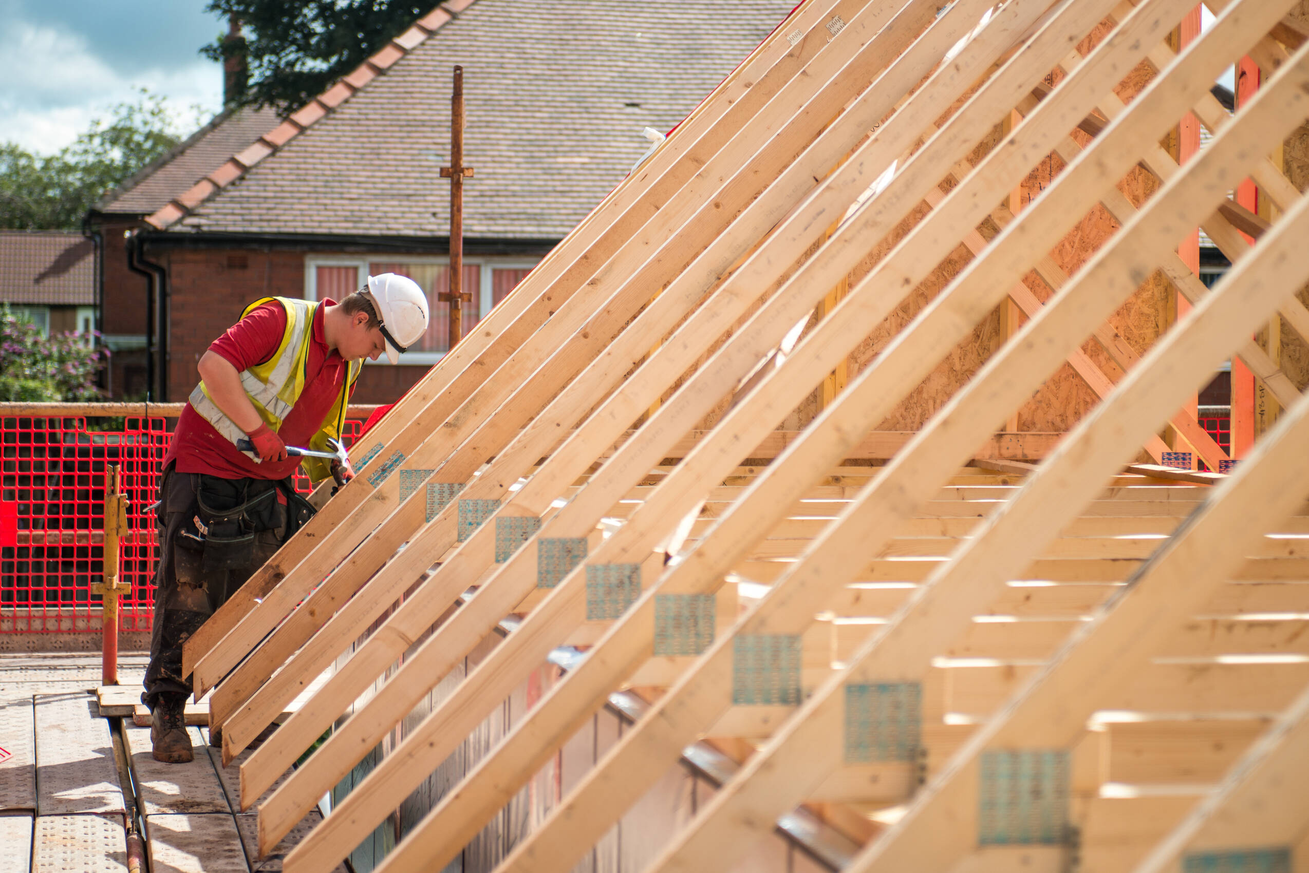 Construction worker building a new house roof 2026 03 10 02 05 34 utc